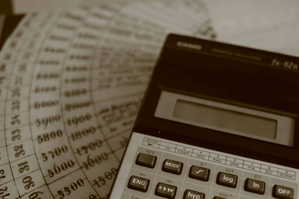 audit writing for beginners illustrated with checklist, laptop, and financial documents